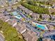 Aerial view of community with pools and tennis court at 4246 Pinehurst Circle # O-6, Little River, SC 29566