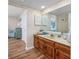 Bathroom with double vanity and large mirror at 4246 Pinehurst Circle # O-6, Little River, SC 29566