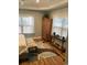 Bright bedroom featuring wood floors and a decorative rug at 430 Long Lake Circle, Conway, SC 29527