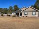 House exterior showcasing a tan siding and spacious yard at 430 Long Lake Circle, Conway, SC 29527