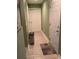 Clean hallway with tile flooring and access to laundry at 430 Long Lake Circle, Conway, SC 29527