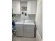 Bright laundry room with washer, dryer, and cabinets at 430 Long Lake Circle, Conway, SC 29527