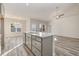 Open concept kitchen with island, gray cabinets, and hardwood floors at 431 Lifestyle Court, Surfside Beach, SC 29575