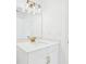 Bathroom featuring single vanity with modern gold fixtures and a large mirror at 45 Northbrook Dr, Murrells Inlet, SC 29576