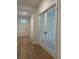 Inviting entryway featuring wood-look floors, modern doors, and natural light, creating a warm and welcoming space at 45 Northbrook Dr, Murrells Inlet, SC 29576