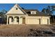 Two-story home with white siding, gray roof and two-car garage at 45 Northbrook Dr, Murrells Inlet, SC 29576