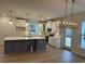 Modern kitchen featuring white cabinets, an island with quartz countertops, stainless steel appliances at 45 Northbrook Dr, Murrells Inlet, SC 29576