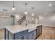 This spacious kitchen features an island with a farmhouse sink and stainless steel dishwasher at 45 Northbrook Dr, Murrells Inlet, SC 29576