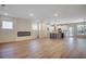 Open-concept living space features modern flooring, recessed lighting, fireplace, and kitchen for seamless entertaining at 45 Northbrook Dr, Murrells Inlet, SC 29576