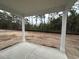 Covered patio with concrete flooring, perfect for outdoor relaxation and enjoying the backyard view at 45 Northbrook Dr, Murrells Inlet, SC 29576