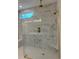 Close up of glass shower with sleek fixtures and bright lighting at 45 Northbrook Dr, Murrells Inlet, SC 29576