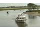 Beautiful water view with boat traffic and marshlands in the distance at 45 Northbrook Dr, Murrells Inlet, SC 29576