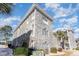 Three-story building with brick facade and balconies at 4705 Wild Iris Dr. # 105, Myrtle Beach, SC 29577