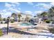 Small community pool and surrounding patio area at 4705 Wild Iris Dr. # 105, Myrtle Beach, SC 29577