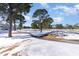 Snow-covered golf course with trees and pathways at 4705 Wild Iris Dr. # 105, Myrtle Beach, SC 29577