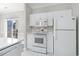 White kitchen cabinets and a microwave above the stove at 4705 Wild Iris Dr. # 105, Myrtle Beach, SC 29577