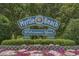 Welcome to Myrtle Beach sign with lush landscaping at 4725 Wild Iris Dr. # 202, Myrtle Beach, SC 29577