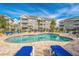 Inviting community pool with plenty of lounge chairs at 4725 Wild Iris Dr. # 202, Myrtle Beach, SC 29577