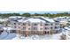 Aerial view of condo building in snowy weather at 4846 Carnation Circle # 203, Myrtle Beach, SC 29577