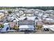 Aerial view of condo community showcasing snow-covered buildings, ample parking, and a pool at 4846 Carnation Circle # 203, Myrtle Beach, SC 29577