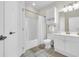 Clean bathroom with a shower/tub combo, vanity, and linen cabinet at 4846 Carnation Circle # 203, Myrtle Beach, SC 29577