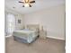 Bedroom featuring neutral walls, a queen bed, and a window for natural light at 4846 Carnation Circle # 203, Myrtle Beach, SC 29577