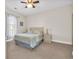 Comfortable bedroom with a queen-size bed, nightstands, and ceiling fan at 4846 Carnation Circle # 203, Myrtle Beach, SC 29577