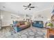 Spacious living room with wood-style flooring, ceiling fan, and comfortable seating at 4846 Carnation Circle # 203, Myrtle Beach, SC 29577