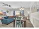Comfortable living space with wood floors, ceiling fan, and sliding doors to the balcony at 4846 Carnation Circle # 203, Myrtle Beach, SC 29577