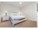 Spacious bedroom with white bed frame and nightstands at 4919 Cinzia Ln. # 6-B, North Myrtle Beach, SC 29582