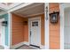 White front door with sidelights and black house numbers at 4919 Cinzia Ln. # 6-B, North Myrtle Beach, SC 29582