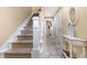 Light-filled stairwell with carpeted steps and white railings at 4919 Cinzia Ln. # 6-B, North Myrtle Beach, SC 29582