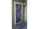 Exterior front door entrance with a screen door and doormat at 500 Myrtle Greens Dr. # A, Conway, SC 29526