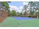 Well-maintained tennis court surrounded by trees at 500 Myrtle Greens Dr. # A, Conway, SC 29526