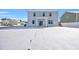 House exterior and snowy backyard with footprints at 545 Goldstar St., Conway, SC 29526