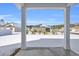 Snowy backyard with a view of the house and privacy fence at 545 Goldstar St., Conway, SC 29526