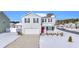 Two-story home with white siding, red door, and snow-covered lawn at 545 Goldstar St., Conway, SC 29526