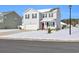 Two-story home with white siding, red door, and snow-covered lawn at 545 Goldstar St., Conway, SC 29526