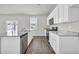 Modern kitchen featuring white cabinets and granite countertops at 545 Goldstar St., Conway, SC 29526