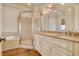 Double vanity bathroom with granite countertops and shower at 55 Pineberry Dr., Georgetown, SC 29440