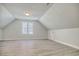 Versatile bonus room with grey wood-look flooring and large window at 55 Pineberry Dr., Georgetown, SC 29440