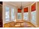 Bright breakfast nook with hardwood floors and sunny window views at 55 Pineberry Dr., Georgetown, SC 29440