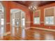 Bright dining room with hardwood floors and an arched doorway at 55 Pineberry Dr., Georgetown, SC 29440