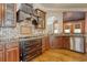 Kitchen with granite countertops, tile backsplash and stainless steel appliances at 55 Pineberry Dr., Georgetown, SC 29440