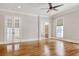 Bright living room featuring hardwood floors and French doors at 55 Pineberry Dr., Georgetown, SC 29440