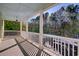 Enjoy the view from this spacious porch, overlooking the wooded backyard at 55 Pineberry Dr., Georgetown, SC 29440