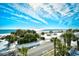 Expansive view of ocean, beach, and palm trees at 5511 N Ocean Blvd. # 309, Myrtle Beach, SC 29577