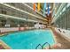 Indoor pool with colorful seating and flags at 5905 S Kings Hwy. # 514-B, Myrtle Beach, SC 29575