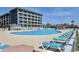 Resort-style pool with plenty of lounge chairs at 5905 S Kings Hwy. # 514-B, Myrtle Beach, SC 29575