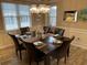 Formal dining area with dark wood table and seating for six at 601 N Hillside Dr. # 4235, North Myrtle Beach, SC 29582